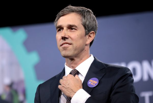 Politician Beto O'Rourke adjusts his tie