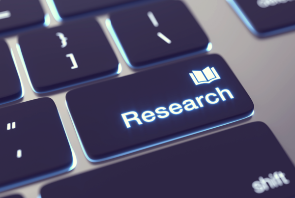 Keyboard with the word "Research" on the enter key